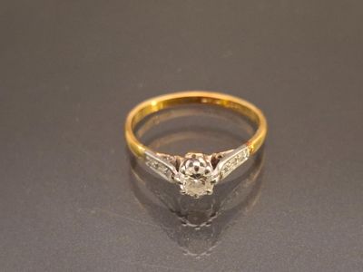 a close up of a diamond ring on a table