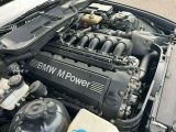 a bmw engine in the trunk of a car