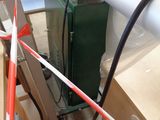 a machine that is sitting on the ground next to a box