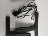 a remote control and a remote control holder on a table