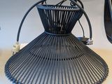 a lamp that is sitting on a table next to a cell phone