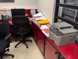 a red desk with a printer and a printer on it