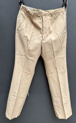 an image of a pair of beige pants hanging on a clothes line