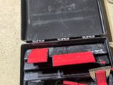 a black case with tools in it sitting on a table