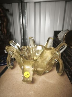 a glass bowl that is sitting on a table