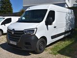 une camionnette blanche garée devant un bâtiment