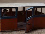 a small toy bus that is sitting on the ground