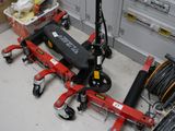 a scooter that is sitting on the floor next to other scooters