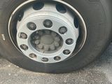 a close up of a flat tire on a truck
