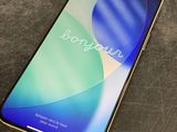 a close up of a phone on a table with a blurry background
