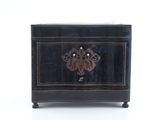 a small black box with a decorative design on it