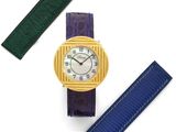 an image of a close up of a wrist watch on a white surface