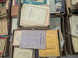 many boxes of books stacked on top of each other