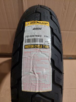 a close up of a motorcycle tire with a price tag on it