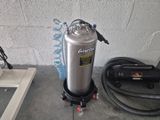 an image of a proprigerator with a hose attached to it