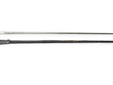 a close up of two swords on a white surface
