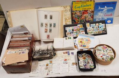 a table with a lot of postcards and other items on it