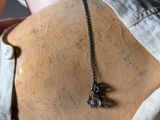 a mannequin with a necklace on it ' s neck