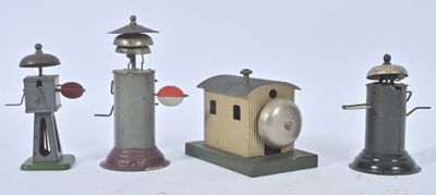 five different types of toy lighthouses on a white surface