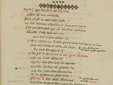 an old book with a black and red writing on it