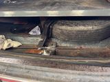 a car that has a tire in the back of it