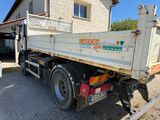 a truck that is parked in front of a house