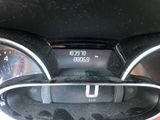 a close up of the dashboard of a car with a clock on it
