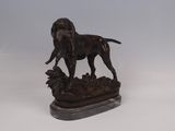 statue of a dog standing on a rock on a white background