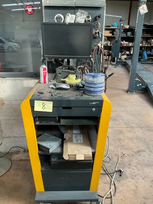 a cart with a bunch of items on it in a garage