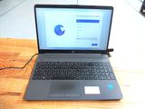 a laptop that is sitting on a table with a mouse