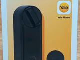 the box is open on a table with a phone in it