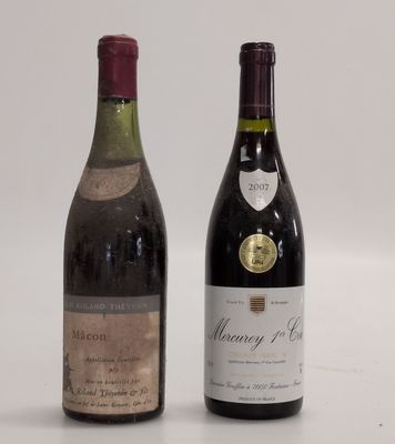 two bottles of wine sitting next to each other on a table