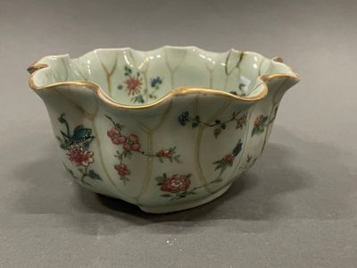 a small bowl that has a flower design on it
