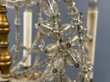 a chandelier with a bunch of beads hanging from it
