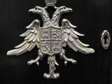 a black chest with a silver eagle on it