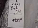 a close up of a label on a wedding dress on a hanger
