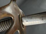 a close up of a metal object with a metal handle