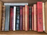 a box full of old books sitting on a table