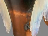 a close up of a vase with a lot of paint on it