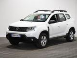 la dacia blanche est garée dans une pièce au sol en damier
