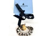 une image représentant un bracelet orné d'un cœur en or