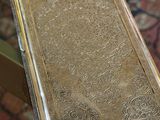 a book sitting on a glass table on a rug