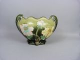 a vase with flowers painted on it on a white background