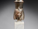 a statue of a woman with a helmet on her head