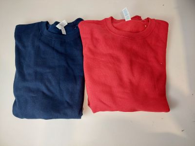 two red and blue t - shirts on a white surface