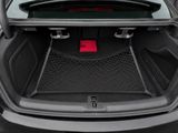 the trunk of a car with its trunk open and a red tag in the trunk
