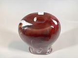 a red vase with a white stripe on the top