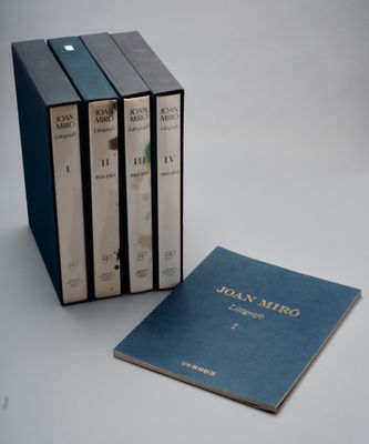 three books are stacked on top of each other on a table