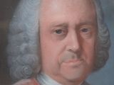 portrait of a man in a red coat and a white collared shirt