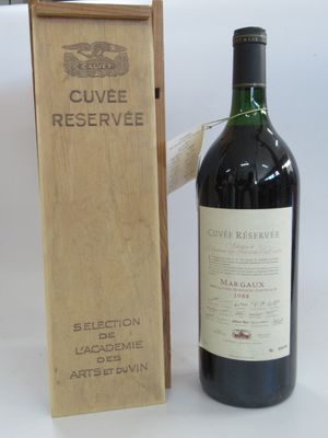 a bottle of wine sitting next to a wooden box